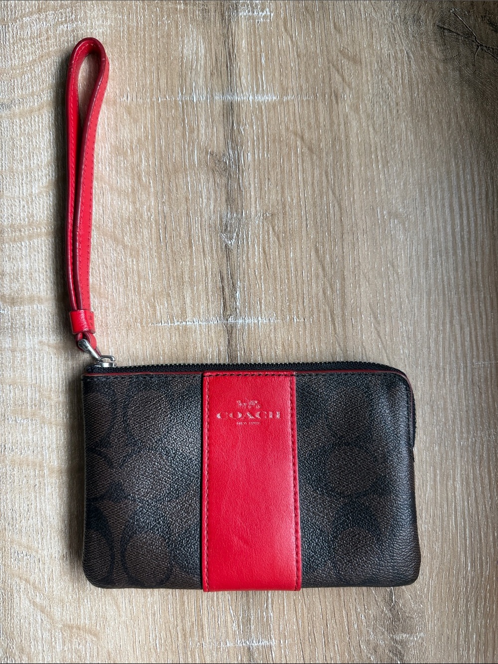 COACH Brown Signature Wristlet with Red Stripe